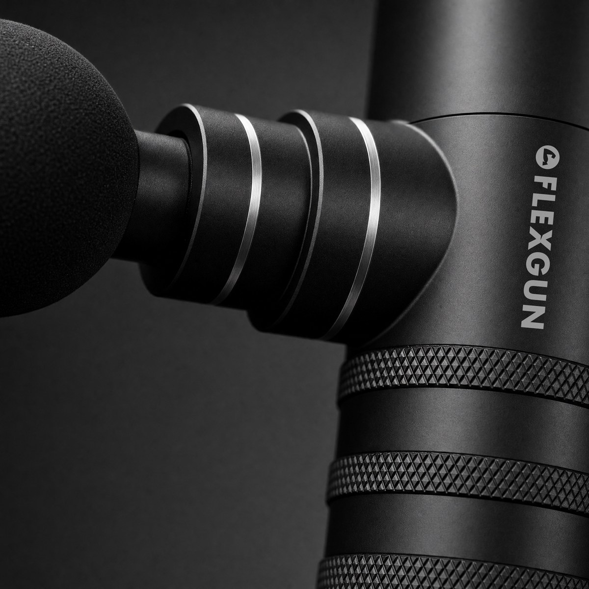 Close view of the Flexgun mini aluminium body, knurled grip and ball head